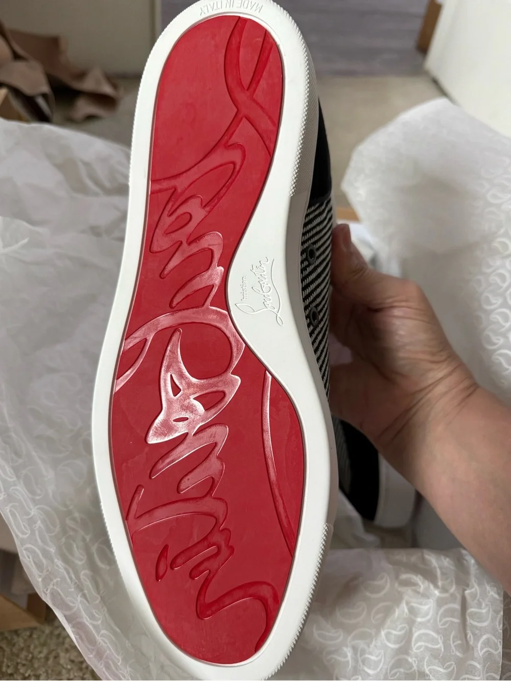 Christian Louboutin bought them